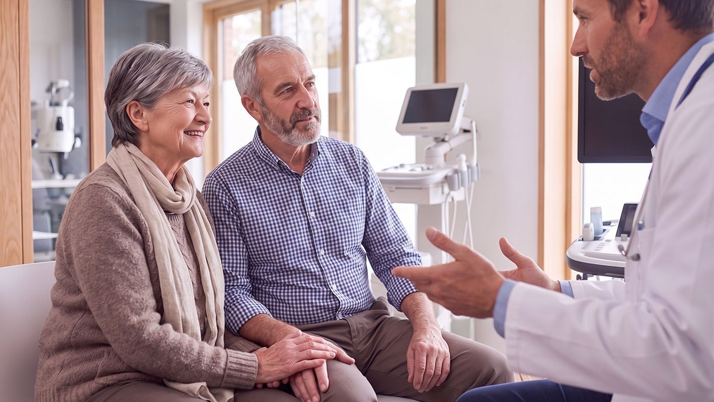  doctor explaining to couple