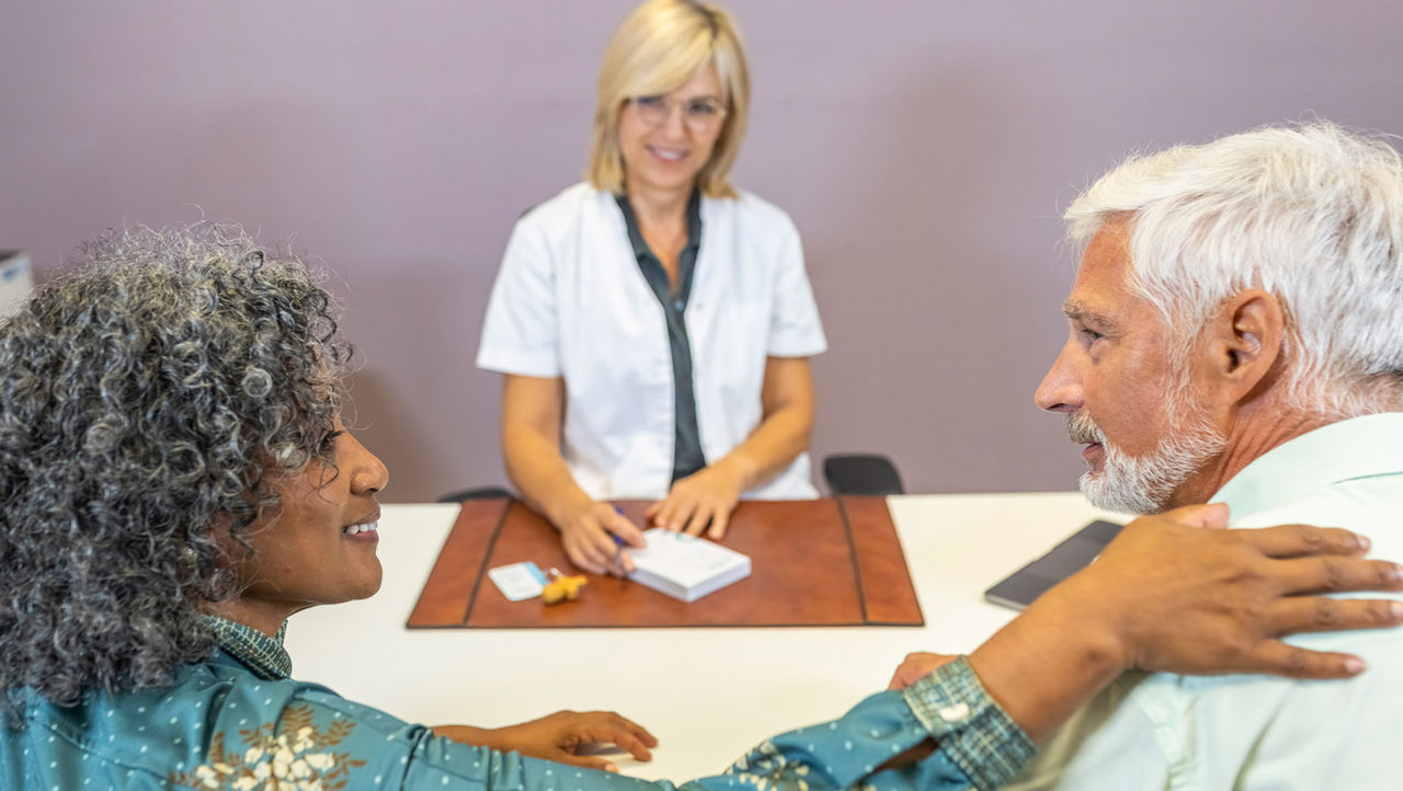 A physician explains unrinary incontinance to her elderly patients