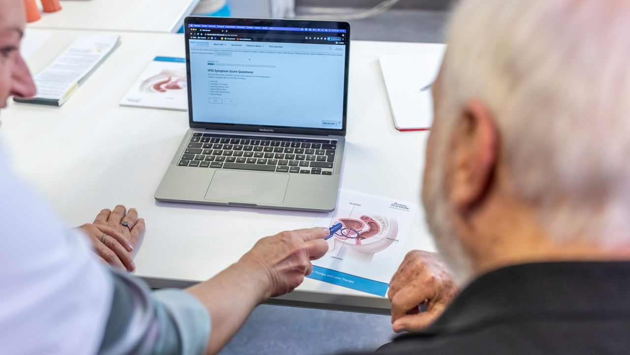 A physician explains unrinary incontinance to her elderly patients