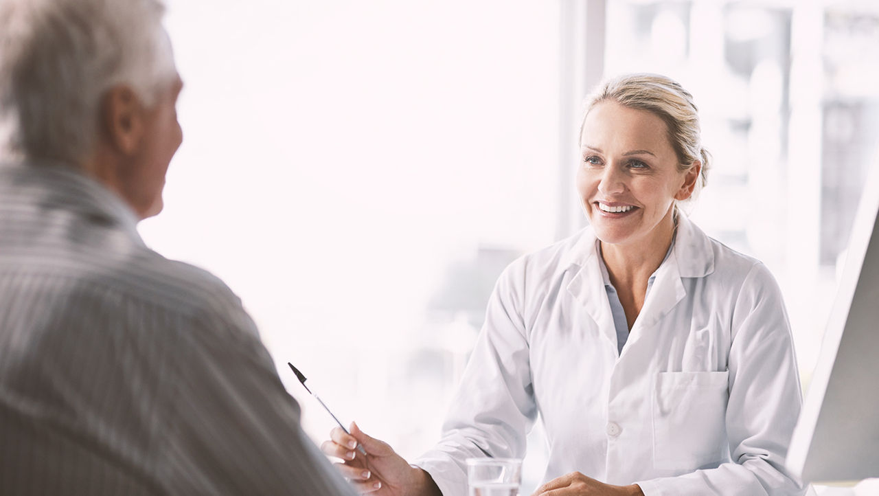 A physician explains unrinary incontinance to her elderly patients