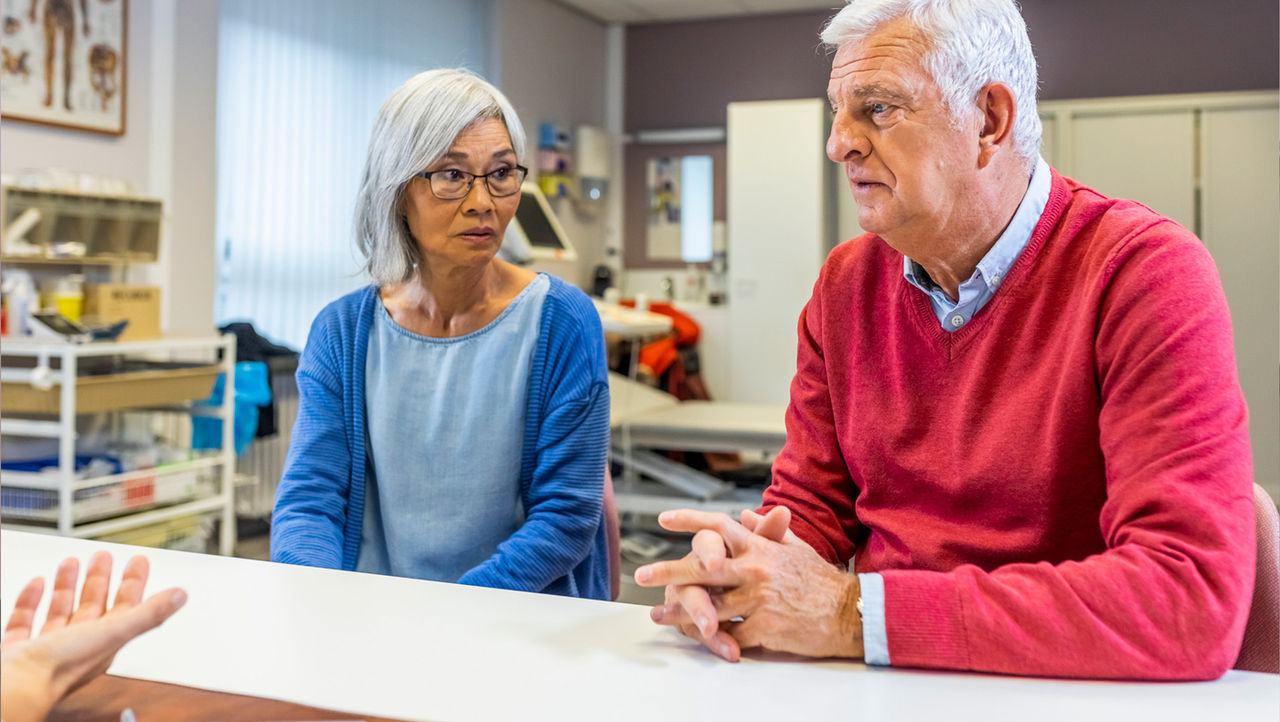 A physician explains unrinary incontinance to her elderly patients