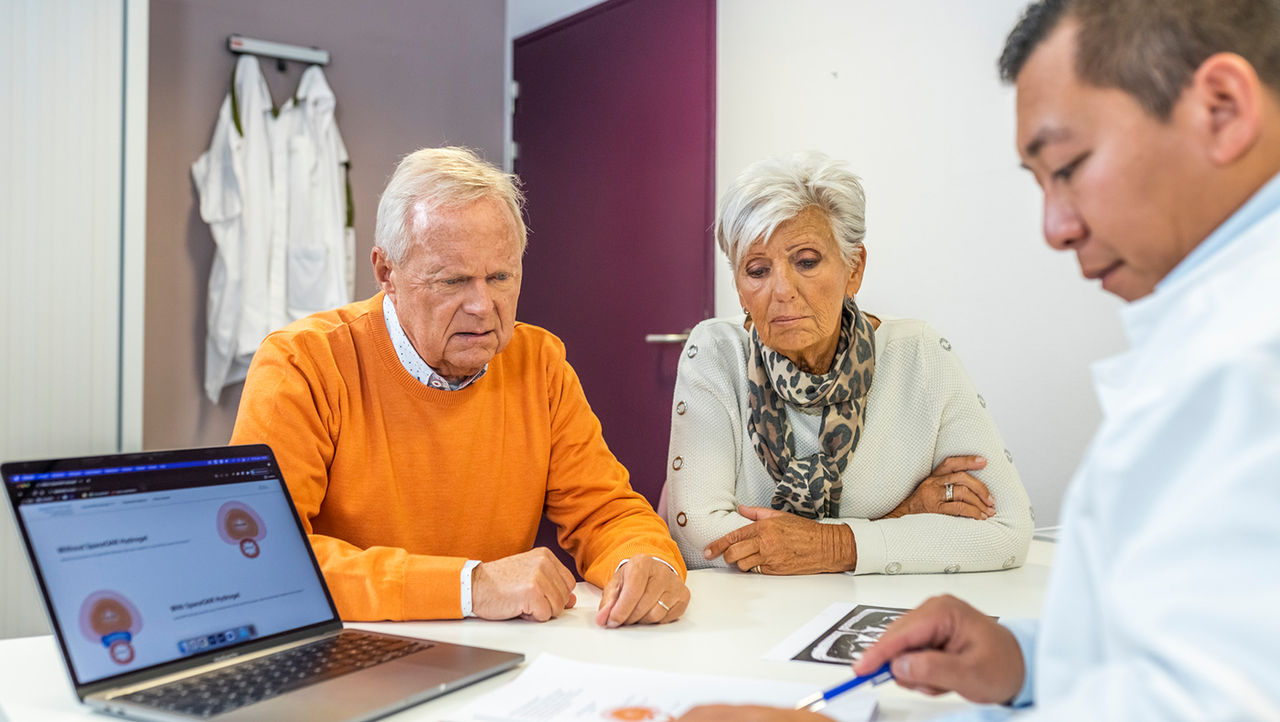 A physician explains unrinary incontinance to her elderly patients